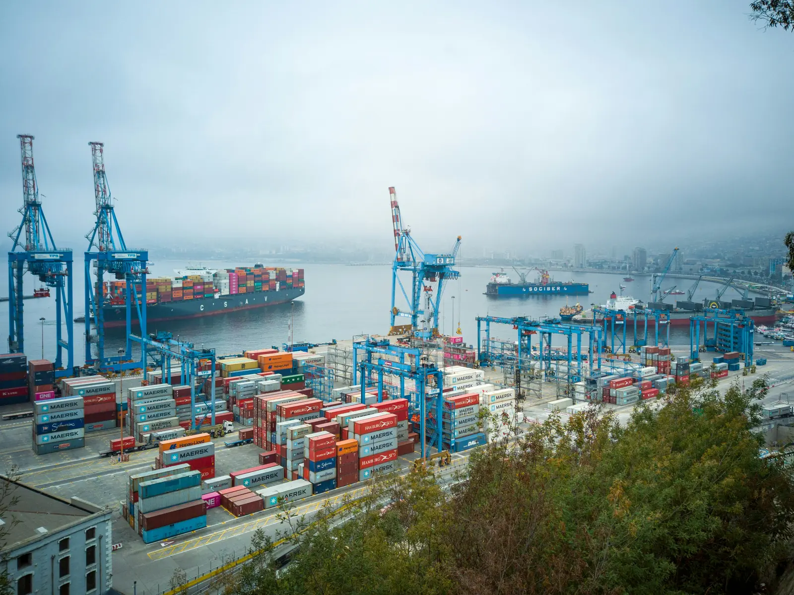 Container terminal with gantry cranes and stacked shipping containers